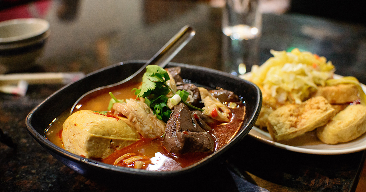 A closeup shot of delicious Taiwanese soup with meat and vegetables